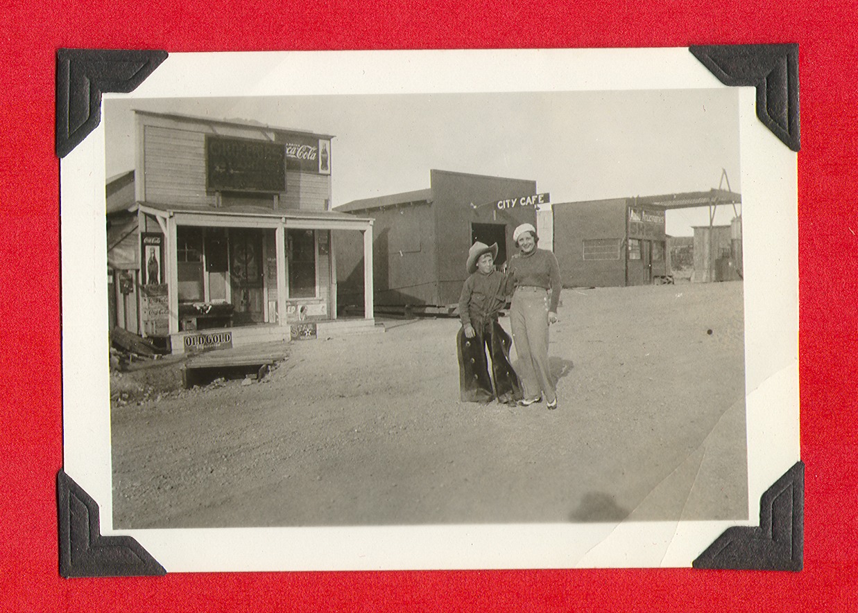 Unidentified child and woman in western town: photographic print
