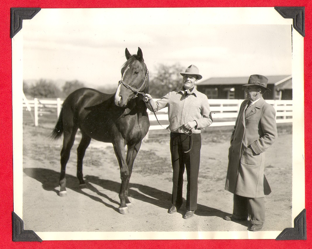 Two unidentified men and Rex Bell's race horse: photographic print
