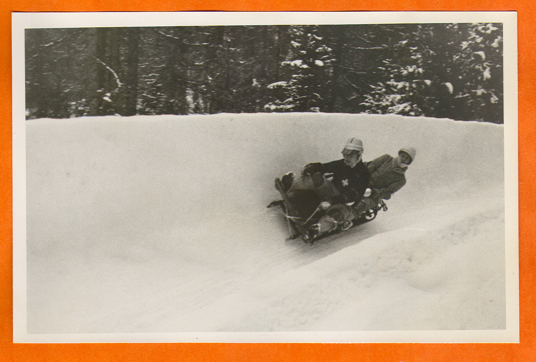 Two people on a bobsled in Europe: photographic print