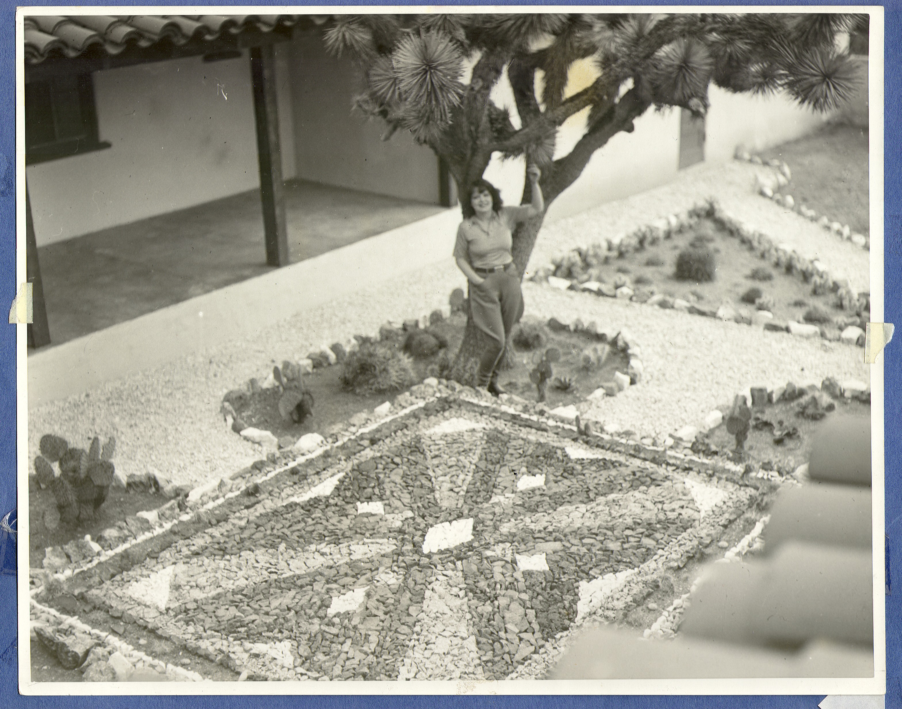 Clara Bow standing in the rock garden at the ranch house: photographic print