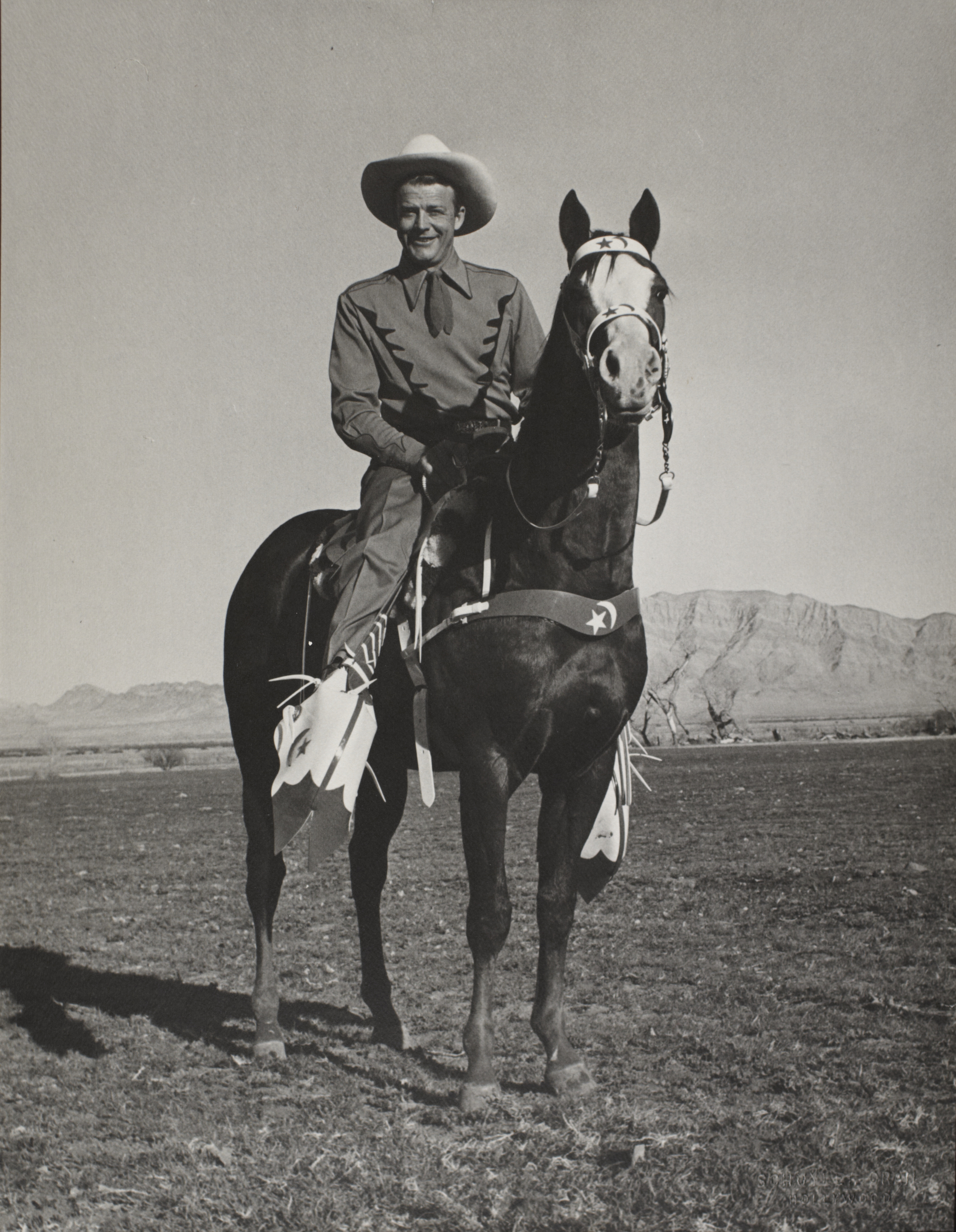 Rex Bell on horseback: photographic print