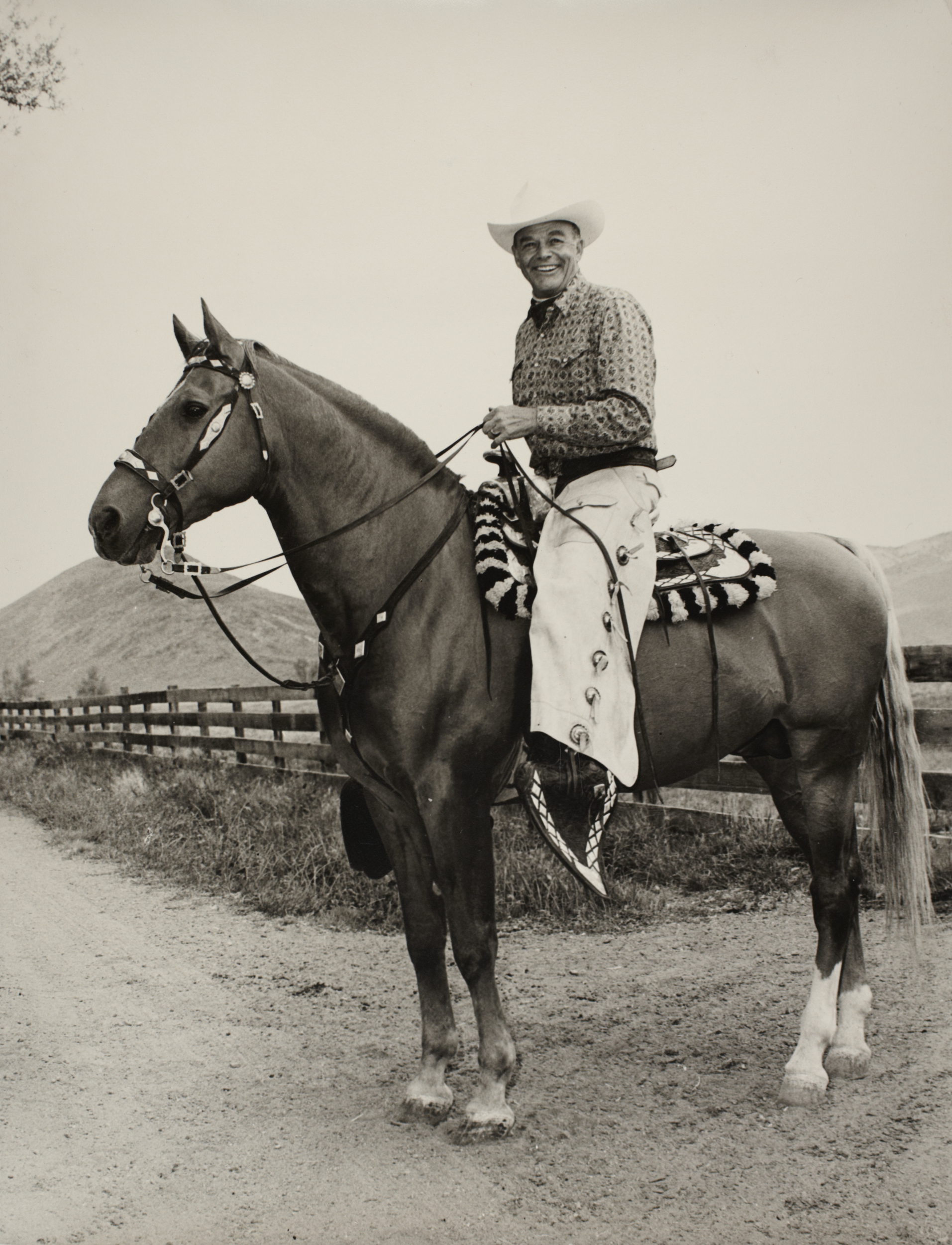 Rex Bell on horseback: photographic print