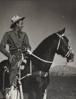 Rex Bell on horseback: photographic print