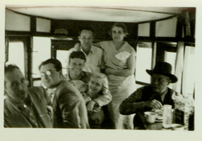 Rex Bell (identified third from left) and an unidentified group of people: photographic print