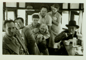 Rex Bell (identified third from left) and an unidentified group of people: photographic print