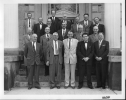 Rex Bell (George Francis Beldam)(front row center) with a group of men outside a building on the steps