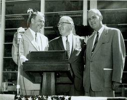 Rex Bell (George Francis Beldam) (left) with two unidentified men at unknown location. Stamped on back: Please credit Reno Chamber of Commerce