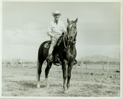 Rex Bell (George Francis Beldam) on horseback at unknown location.  Horse's name is Buddy