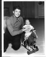 Photo of Rex Bell (George Francis Beldam) with Rex Anthony Bell, Jr (Toni Larbow Beldam) as an infant