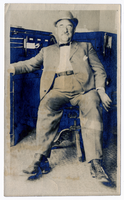 Photograph of H. D. MacMaster seated at a desk, Goldfield (Nev.), 1907