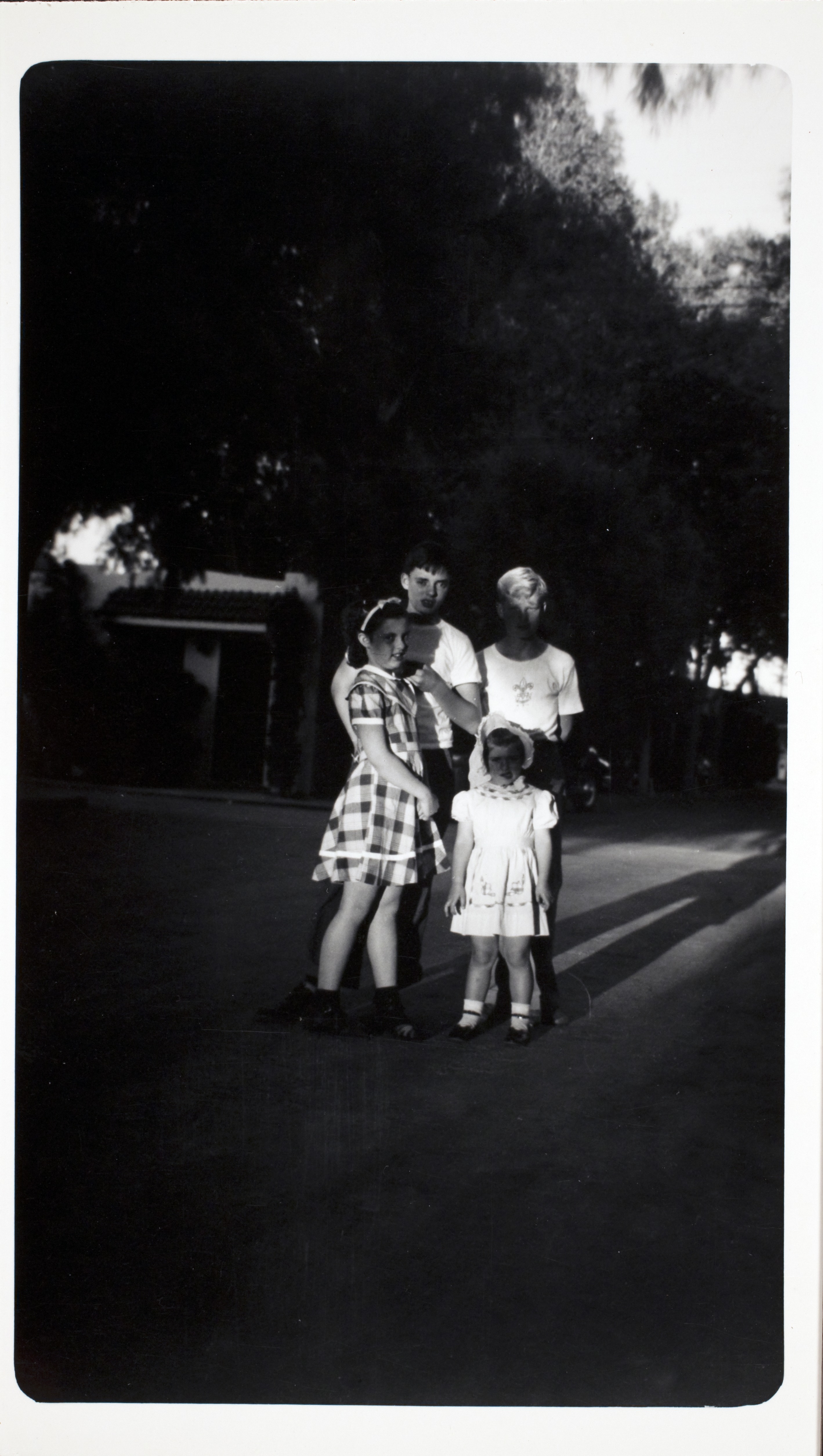 Rex Anthony Bell, Jr (Toni Larbow Beldam) in Boy Scout shirt on right with unidentified people, unknown location: photographic print