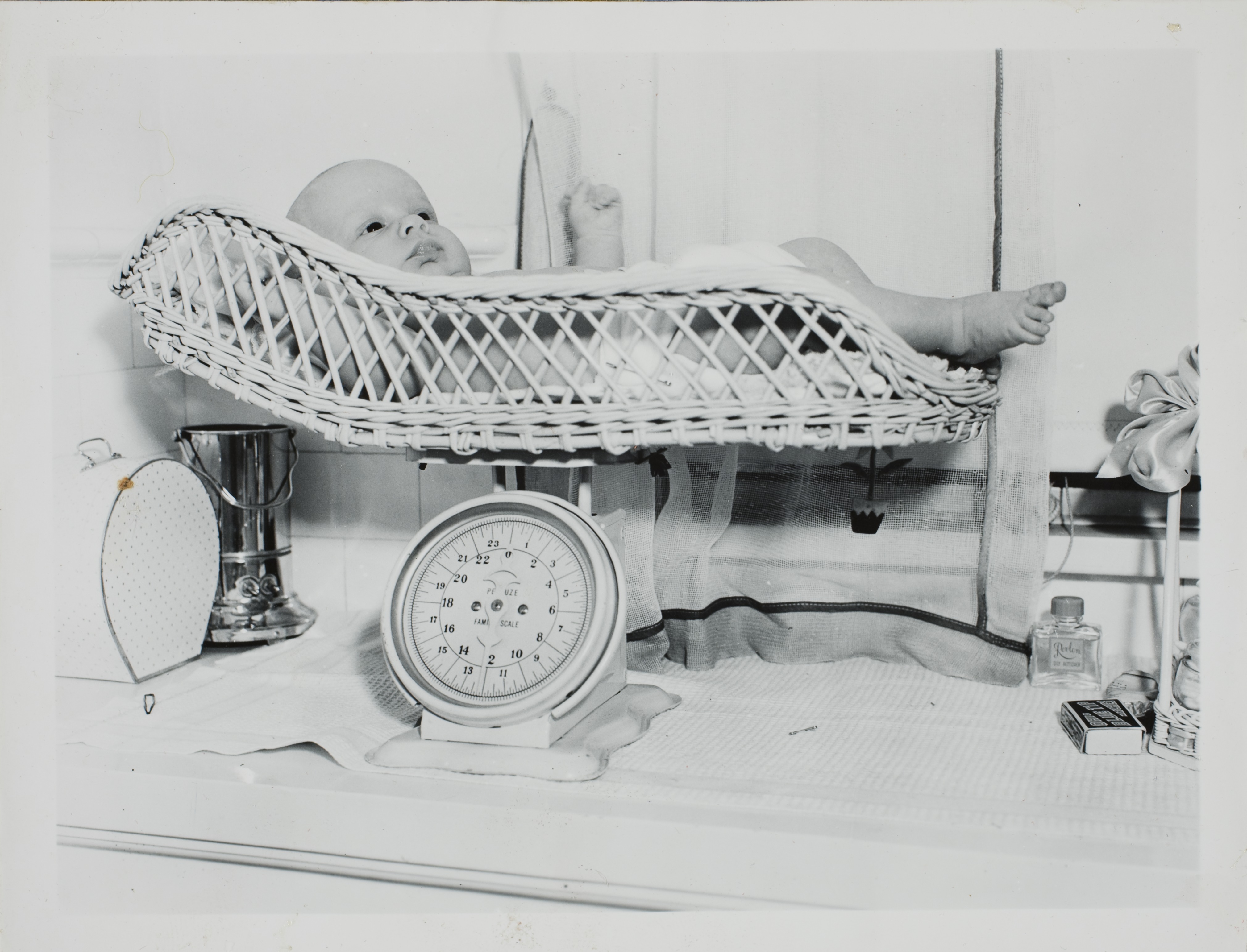 George Francis Robert Bell, age one month. He is on the baby scales: photographic print