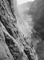 Film transparency of workers scaling the walls of the canyon, Hoover Dam, circa early 1930s