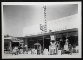 Photograph of people with picket signs in front of Cashman's automobile dealership, Las Vegas, circa 1940s