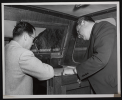 Photograph of two unidentified men at the Decennial, Hoover Dam, circa October 1946