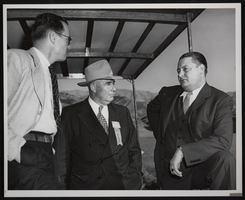 Photograph of three unidentified men at the decennial, Hoover Dam, October 1946