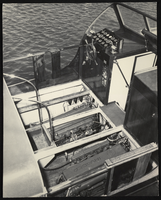 Photograph of passenger boat steering and control panel and engines, Lake Mead, circa 1930s-1950s