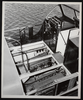 Photograph of passenger boat steering and control panel and engines, Lake Mead, circa 1930s-1950s