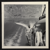 Photograph of passenger on power boat, circa late 1930s-1950s