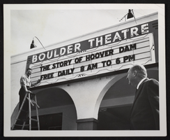 Photograph of John L. Manis in front of Boulder Theatre, Boulder City, Nevada, circa 1950s