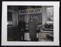 Photograph of William French and John L. Manis inside Visitor's Bureau, circa 1950s
