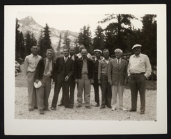 Photograph of James Cashman among an unidentified group in the mountains, circa 1950s