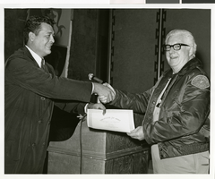 Black-and-white photograph of a Sands Hotel employee receiving a certificate of merit, Las Vegas, October 3, 1968