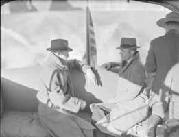 Film negative showing men on a boat on Lake Mead, January 1938