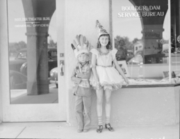 Film transparency showing children in front of Boulder Dam Service Bureau Building, Boulder City, Nevada, circa 1932-1940s