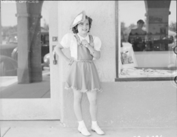 Film transparency showing a girl outside Boulder Dam Service Bureau Building, Boulder City, Nevada, circa 1932-1940s
