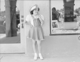 Film transparency showing a girl outside Boulder Dam Service Bureau Building, Boulder City, Nevada, circa 1932-1940s