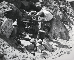 Photograph of a man during construction of the Hoover Dam, April 10, 1931