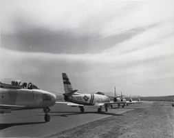 Black-and-white photograph of F-86 fighter aircraft at Nellis Air Force Base, Nevada, circa mid 1950s