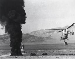 Black-and-white photograph of a Kaman HH-43 firefighting/rescue helicopter in flight, Las Vegas, circa late 1950s-1960s