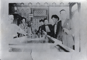 Photograph of people in a bar, circa early 1900s