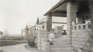 Photograph of Russel Squires on the steps of the Squires home, Las Vegas, circa 1906