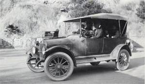 Photograph of people in a vehicle, circa early 1900s