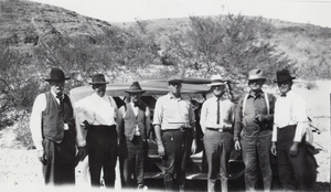 Photograph of men in front of truck, circa 1920s-1940s