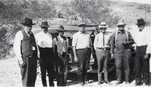 Photograph of men in front of truck, circa 1920s-1940s