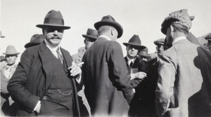 Photograph of men outdoors, circa early 1900s