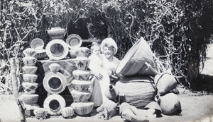 Photograph of Helen J. Stewart with a baby, circa 1910s