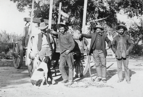 Photograph of men in front of wagon, November 1908