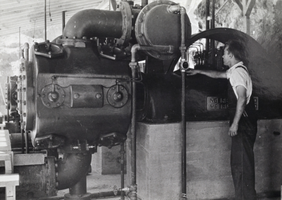 Photograph of a man operating machinery at Hoover Dam, 1931
