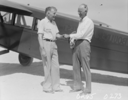 Film transparency of men in front of an aircraft, Las Vegas, 1929-1930