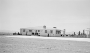 Photograph of Mayme Stocker in front of the Stocker home Las Vegas, Nevada, circa 1930's-1950's