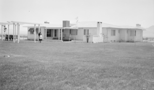 Photograph of Mayme Stocker in front of the Stocker home Las Vegas, Nevada, circa 1930's-1950's