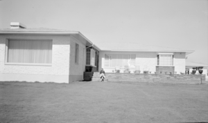 Photograph of Mayme Stocker in front of the Stocker home Las Vegas, Nevada, circa 1930's-1950's