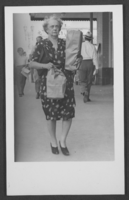 Postcard of Mayme Stocker carrying bags in Las Vegas, Nevada, circa late 1940's-1960's