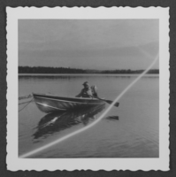 Photograph of Maybe Stocker in a rowboat, Alaska, September 14, 1958
