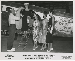 Black-and-white photograph of Miss Universe contestants by a Desert Inn private plane, Long Beach, California, 1956